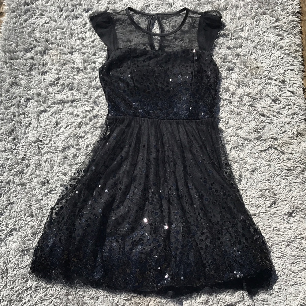 Delia’s black party dress